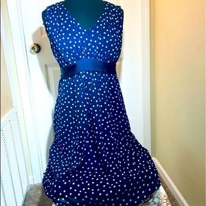 Polka dot with ribbon belt   Sheer lined navy dress. Sleeveless V neckline